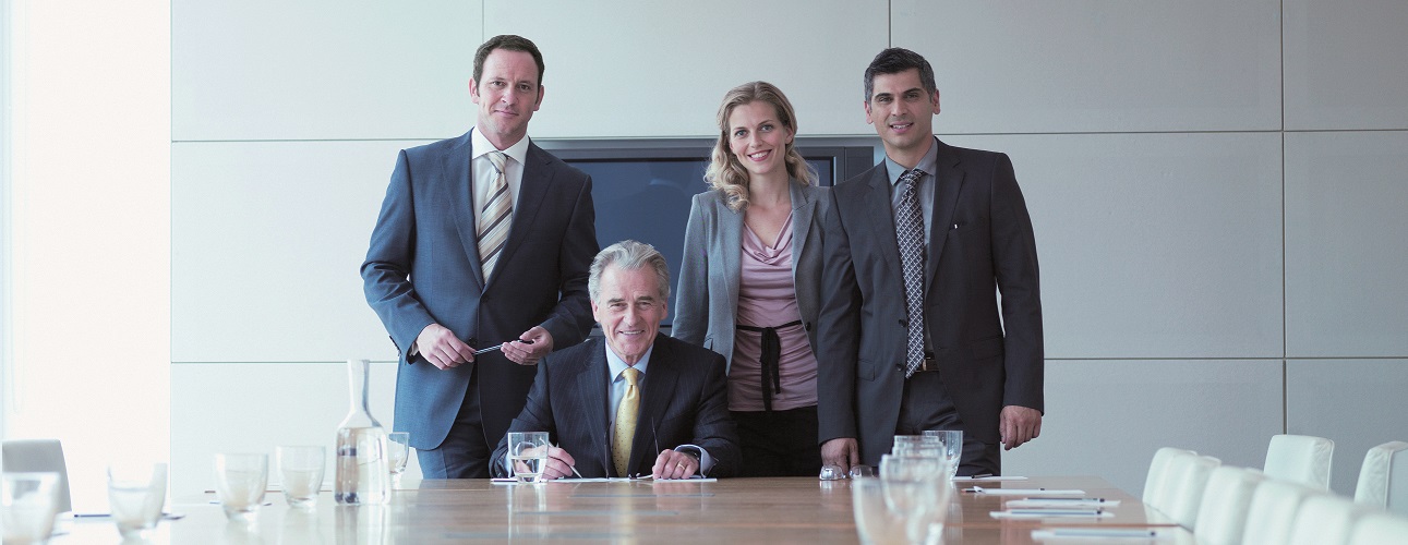 Business people standing together in conference room